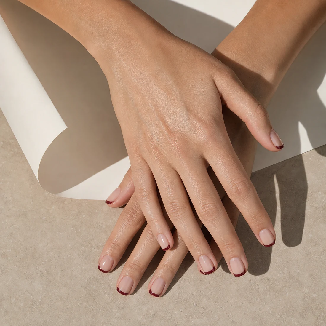 Translucent manicure with wine micro French tips