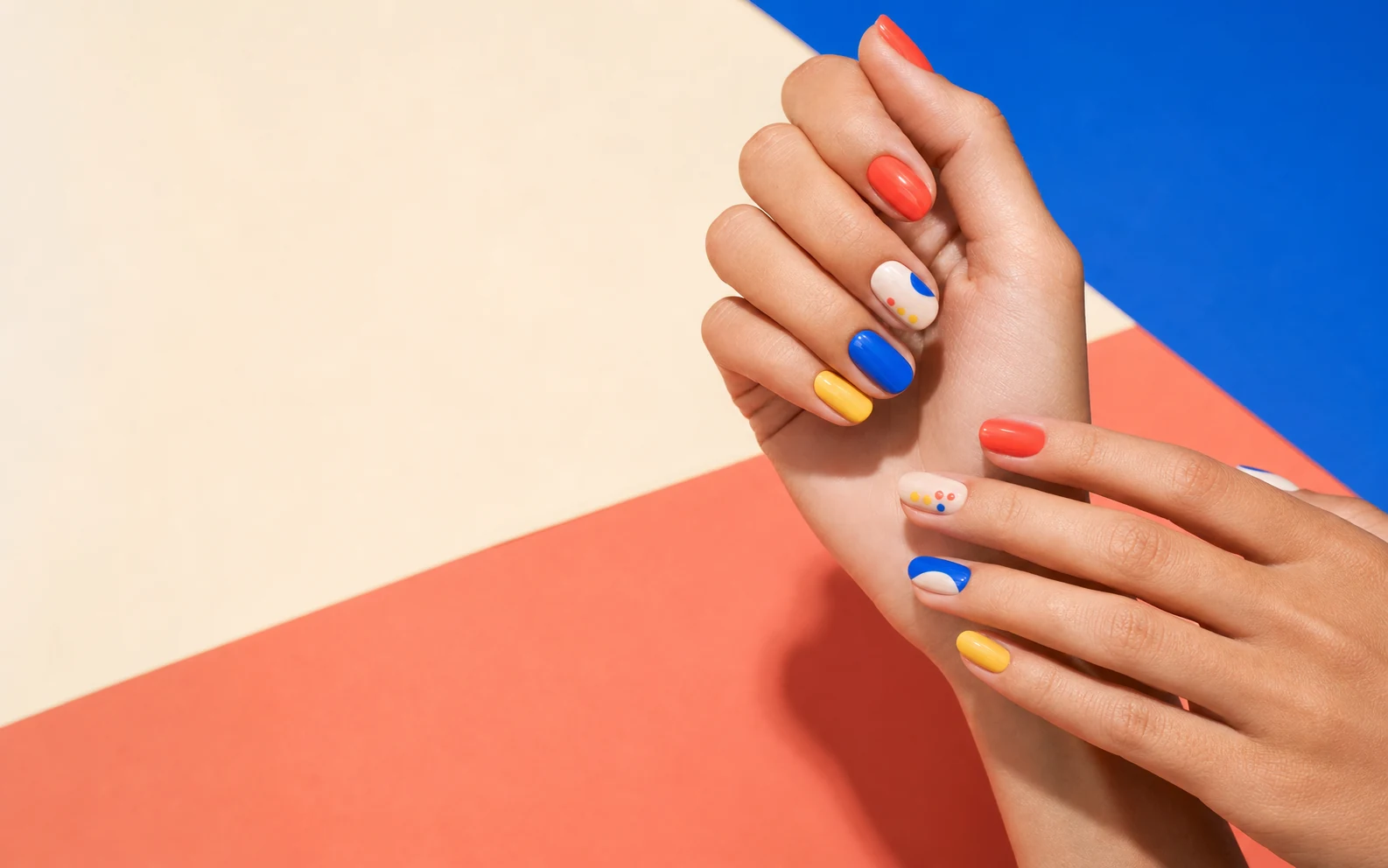 Coral, cobalt and butter yellow graphic manicure